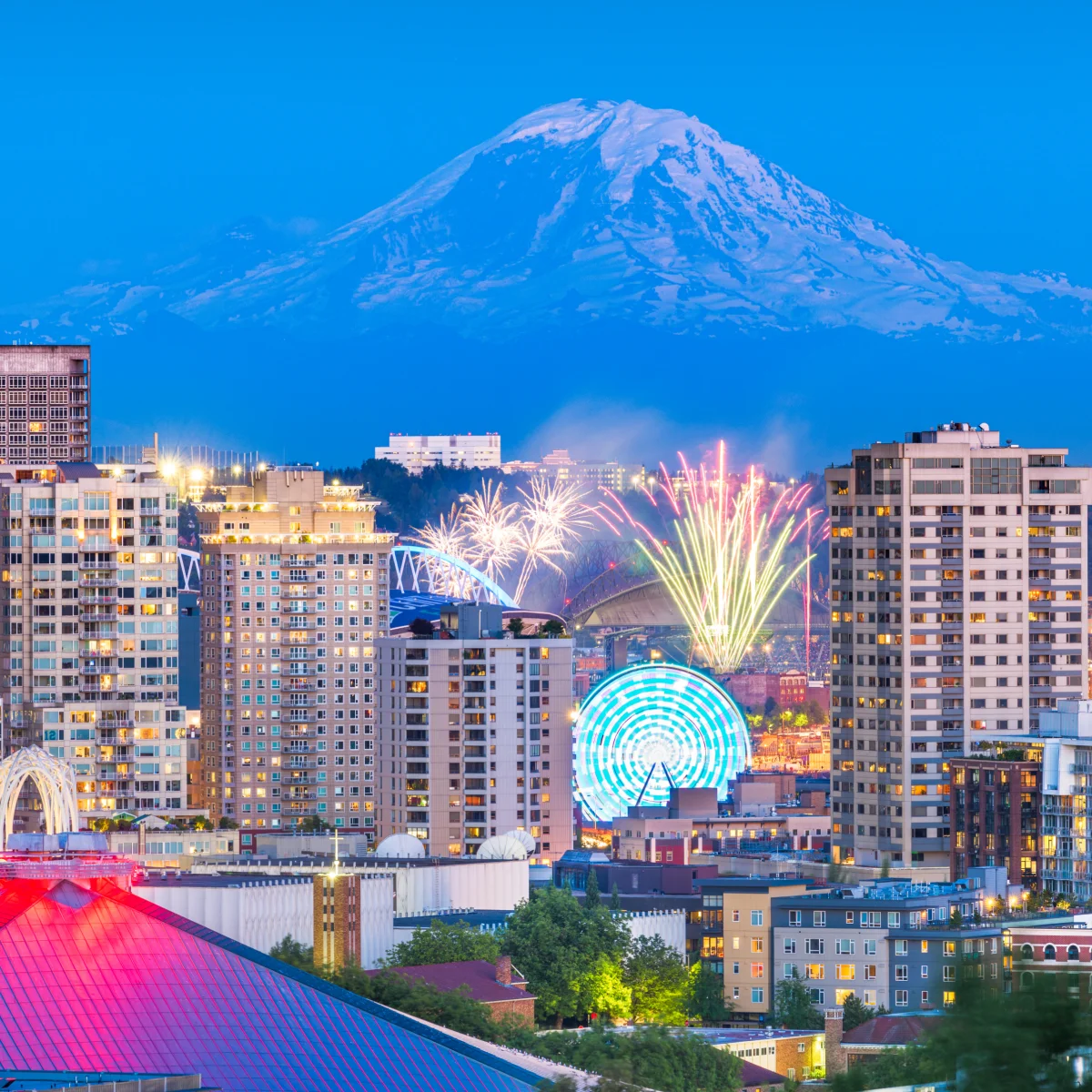 Mobile app development team reviewing a cloud-native build for a Seattle company