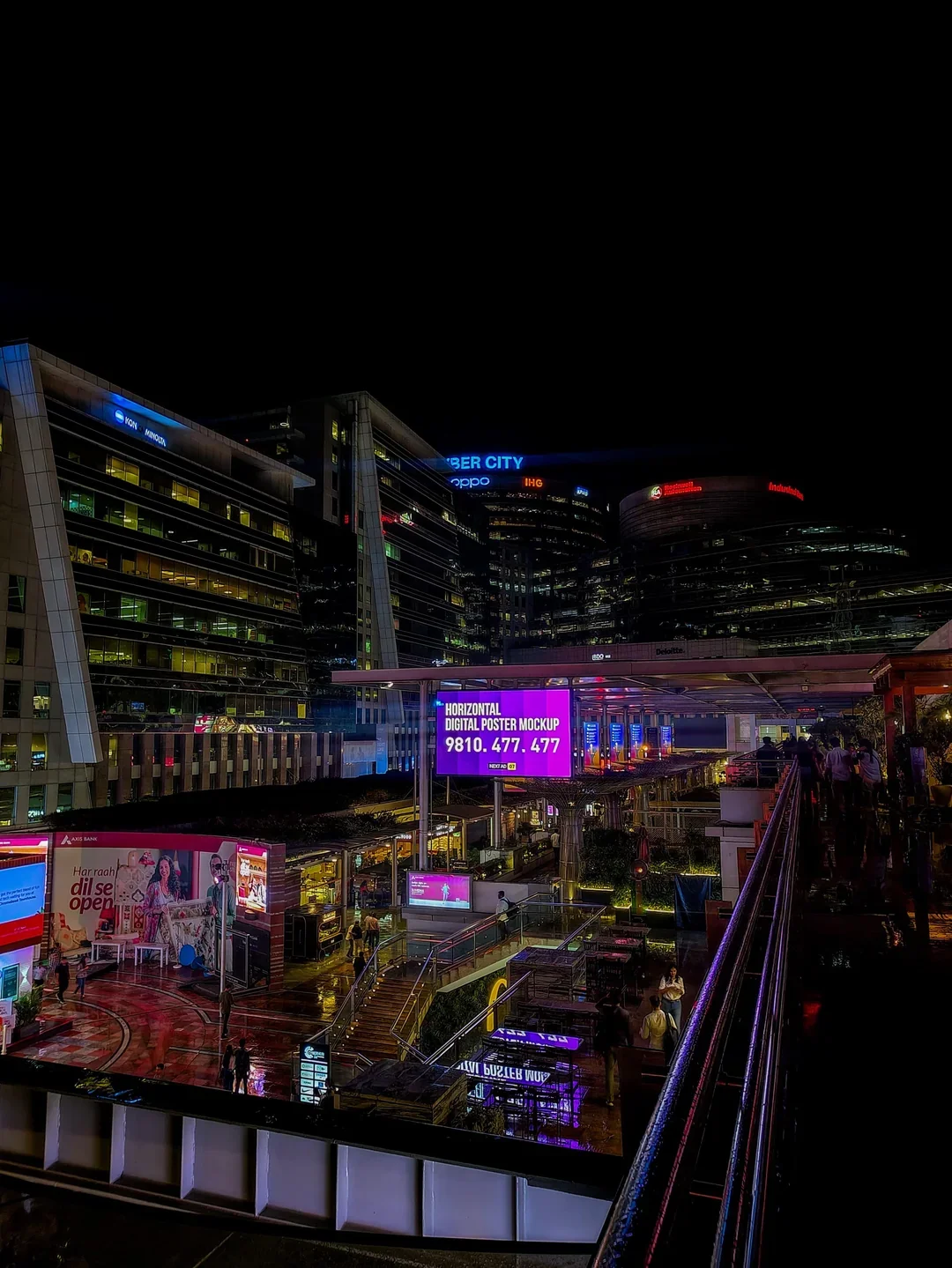 Evening view of Cyber City office towers in Gurugram, a crowded and high-value local marketing landscape